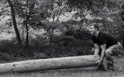Photo of stew smith lifting a log
